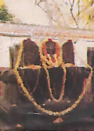 A garlanded devotional photo of the samadhi/brindavana shrine of Sri Brahmanya Tirtha