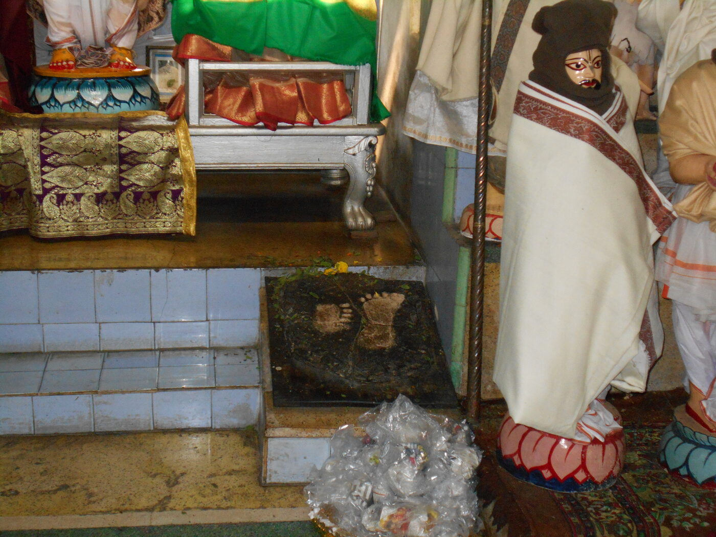 The footprint of Sri Chaitanya Mahaprabhu enshrined at Sribas Angan, Nabadwip, the courtyard where Srivasa Thakura kept his family's grief hidden so that kirtana would not be interrupted.