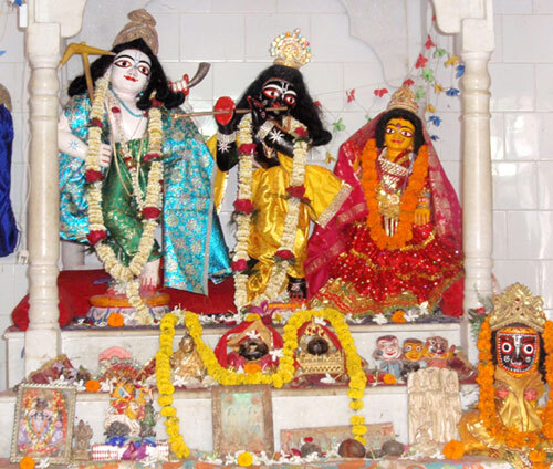 A photograph of the Sri Sri Radha-Gopinatha Deities (with Baladeva at left) installed by Parameshvara Dasa Thakura at his shripat in Atapur, Hugli district, still worshiped there today.