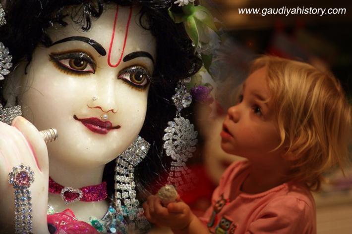 A Gopinatha Deity (ISKCON Belgium, Radhadesh) with a young child looking up in devotion, illustrating the pastime of a child feeding the Lord.