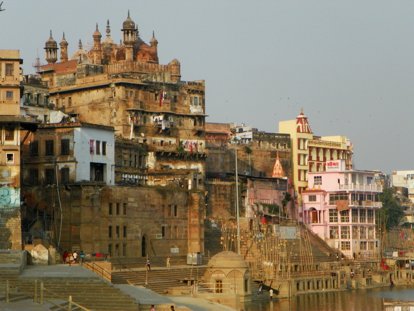 The riverfront ghats of Varanasi, the setting for Sri Chaitanya Mahaprabhu's two-month stay in the city, when the boy Raghunatha massaged His feet after His daily meal at Tapana Mishra's house.
