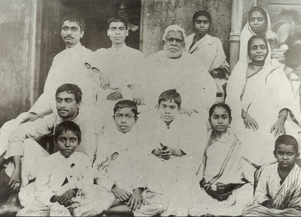 Bhaktivinoda Thakura with his family; Bimal Prasad (later Bhaktisiddhanta Sarasvati) is first from left, top row