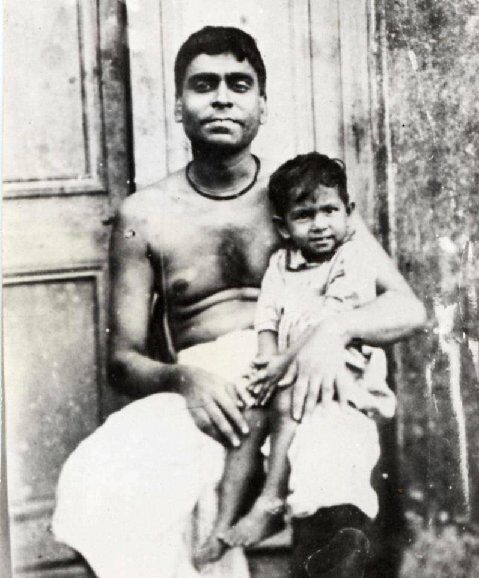 Kedarnath Datta (Bhaktivinoda Thakura), father of Bhaktisiddhanta Sarasvati, with a child, ca. 1870