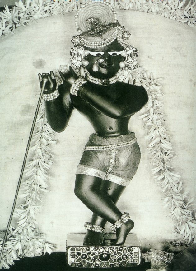 A vintage devotional photograph of Sri Radha Raman, the self-manifested Deity later installed in Vrindavana by Venkata Bhatta's own son, Gopala Bhatta Goswami - the living continuation of the household's turn toward Krishna bhakti that bega