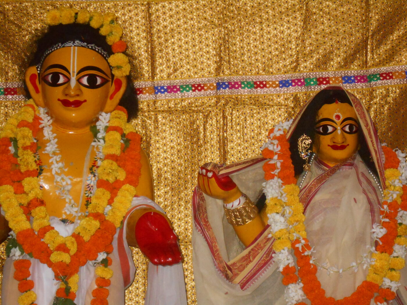 Wooden deities of Sri Advaita Acharya and his wife Sita Devi at the Sitanath Advaita Mandir in Nabadwip.